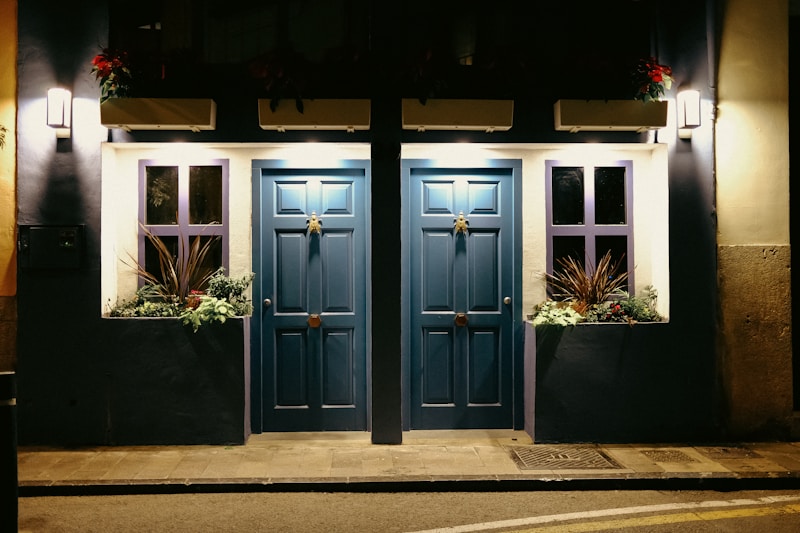 a couple of blue doors sitting next to each other